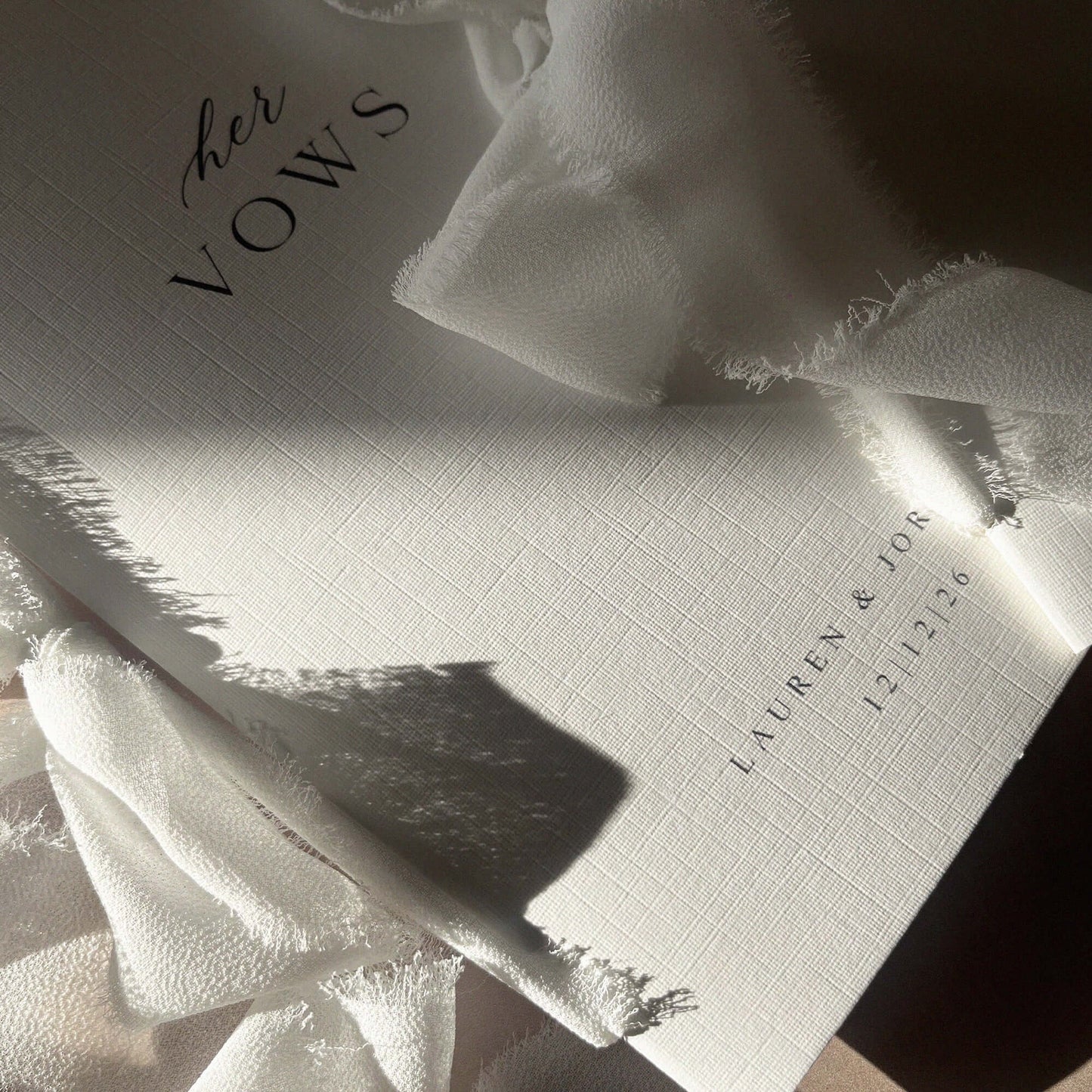 Linen paper vow books bound with white chiffon ribbon perfect for weddings