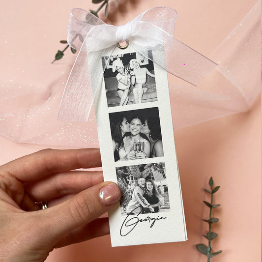 Woman's Hand holding the Personalised luxury bridesmaid proposal or thank you card with black and white photos and white organza ribbon.
