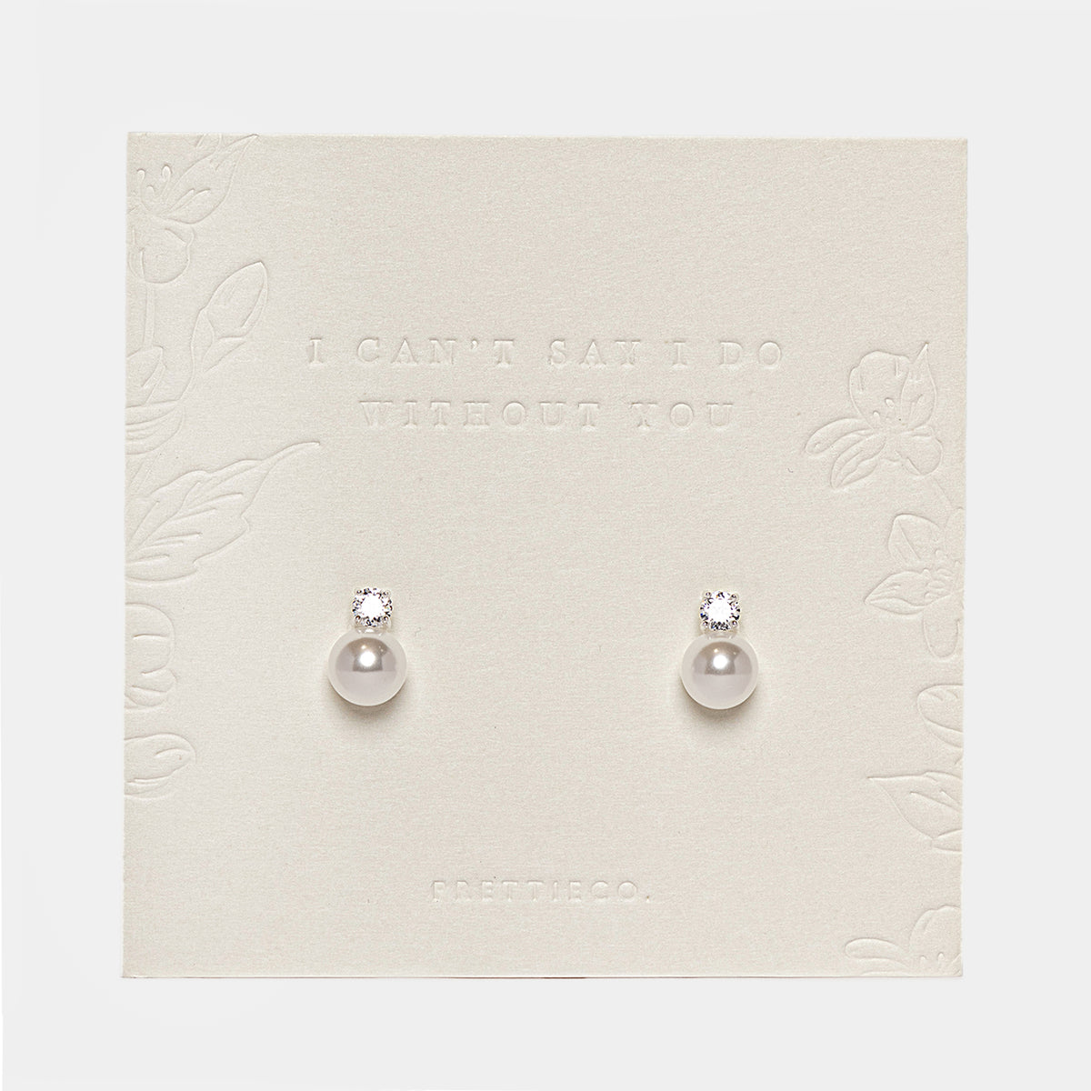 Pearl drop stud earrings on embossed PrettieCo backing card