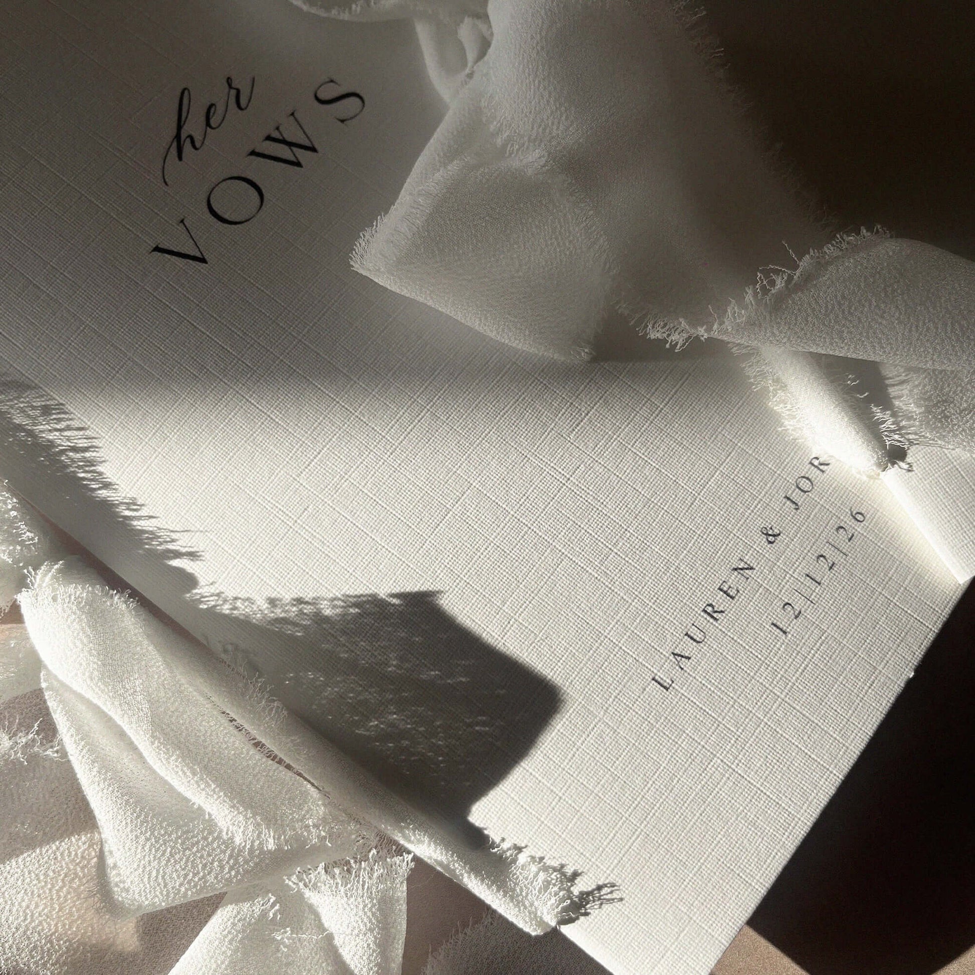 Linen paper vow books bound with white chiffon ribbon perfect for weddings