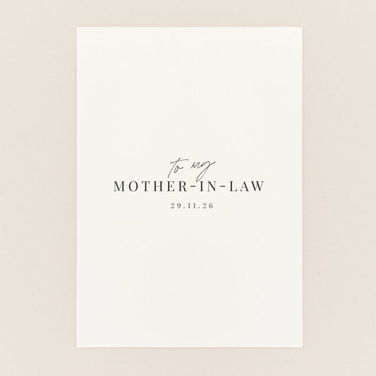 A minimalist white square card or print with elegant black text reading 'to my MOTHER-IN-LAW' and the date.